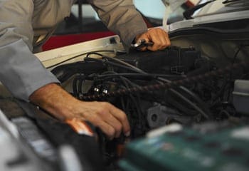 Mechanic Working on Car